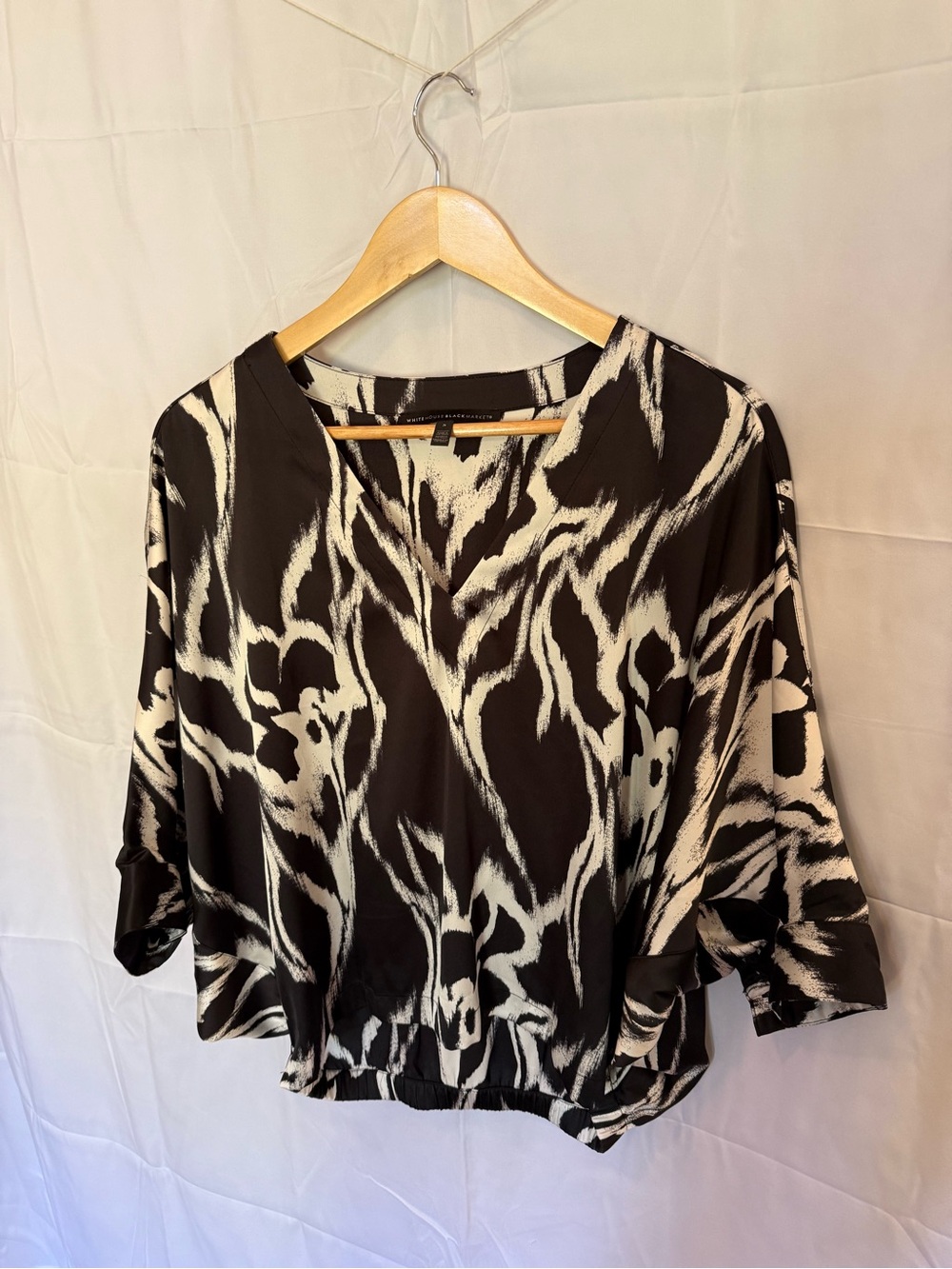 White House Black Market Black and White Abstract V-Neck Blouse